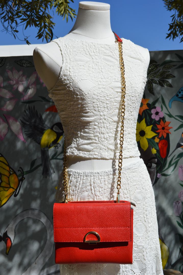 compact crossbody bag with chain