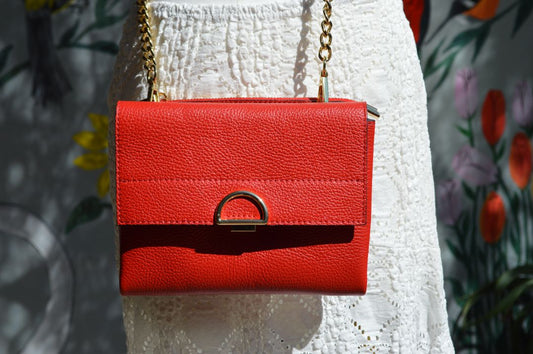 compact crossbody bag with chain